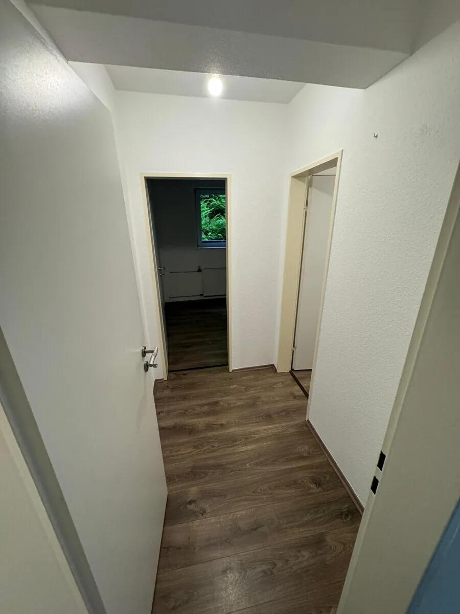 Mehrfamilienhaus mit 8 Wohnungen und 8 Garagen, Bild 5